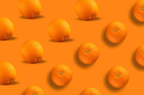 istock Seamless pattern of citrus fruit - orange on orange background. Fresh repeating orange fruit on orange background 1490126266