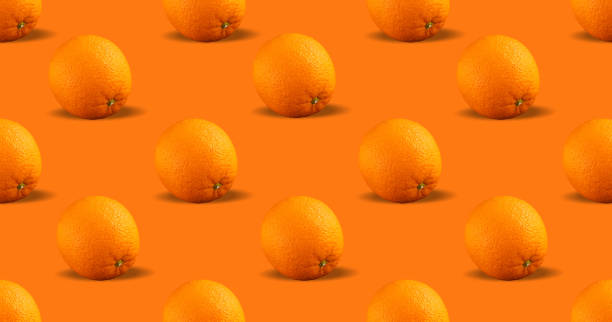 istock Seamless pattern of citrus fruit - orange on orange background. Fresh repeating orange fruit on orange background 1490126303
