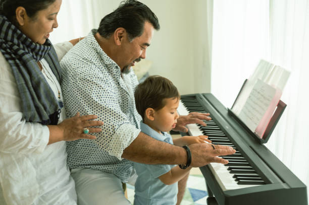 istock Grandparents with grandson playing piano 1490126821