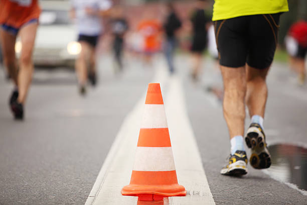 istock Big color cone on road between running people 149012919
