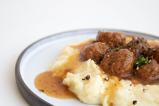 Tasty Home-Made Meat balls with brown gravy and mashed potato