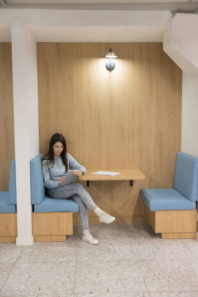 istock Young business freelancer woman working in office booth 1490130837