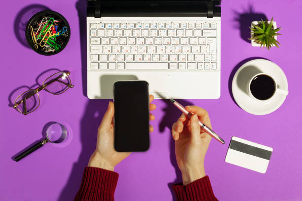 istock Women's hands with business supplies. 1490132220
