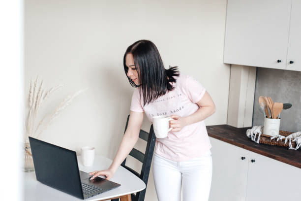 istock Young woman working from home. Getting her home business up 1490132582