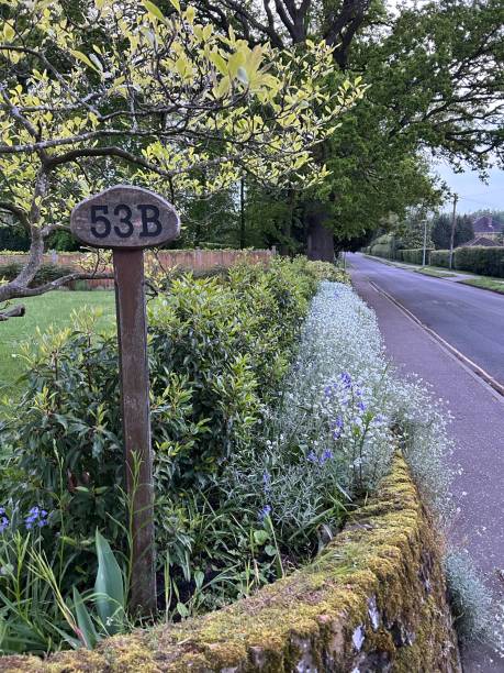 istock A house number post standing next to the flowerbed 1490133523