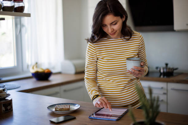 istock Young woman using digital tablet at home 1490133722