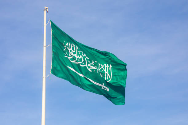 istock Saudi Arabian flag waving on the wind, Jeddah, Saudi Arabia 1490133738