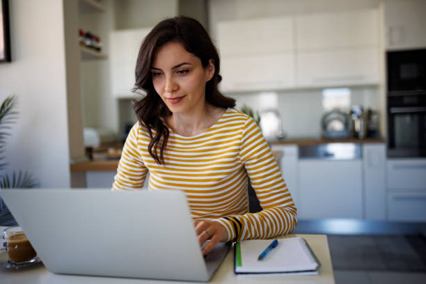 istock Young woman working at home 1490133751