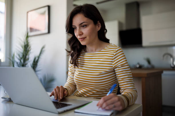 Young woman working at home stock photo