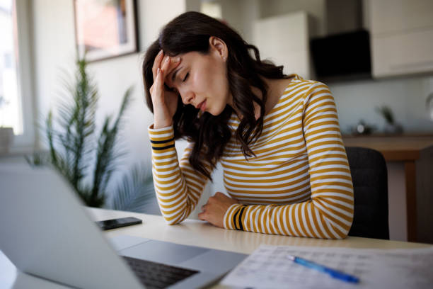 istock Desperate young woman feeling stressed about financial problems 1490133849