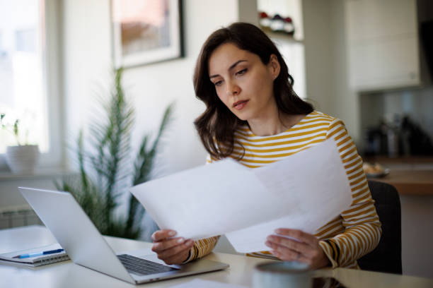 istock Serious young woman working at home 1490133894