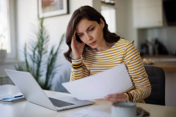 istock Serious young woman working at home 1490134484