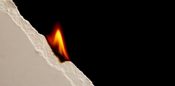white sheet of paper with fire