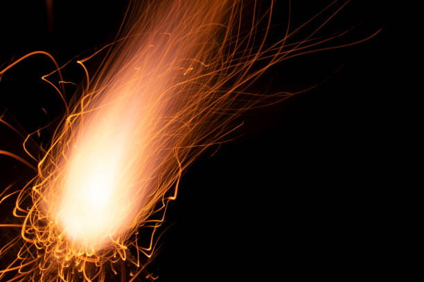 istock fire in dark. luminous lines of sparks. explosion black powder. 1490134856