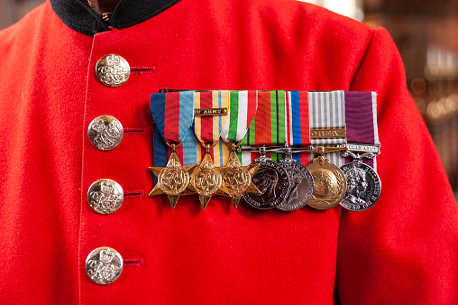 London, UK - February 26, 2010: War medals worn on the scarlet coat of In-Pensioner at the Royal Hospital Chelsea
