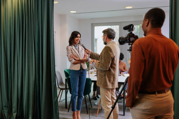 istock Cheerful businesswoman being interviewed by media. 1490135687