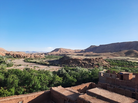 View of mountains, trees, sky and water in south of Morocco