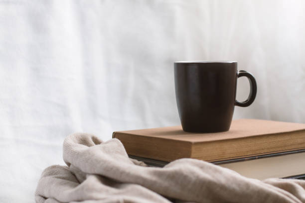 istock Simple composition of indoor relaxation with coffee and books. 1490137934