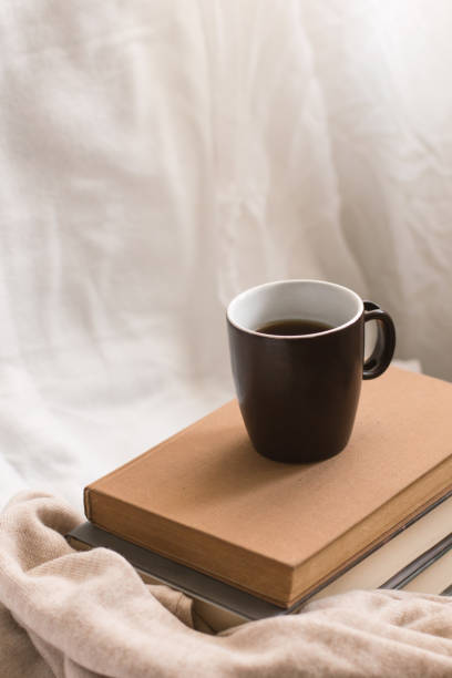 istock Simple composition of indoor relaxation with coffee and books. 1490137944