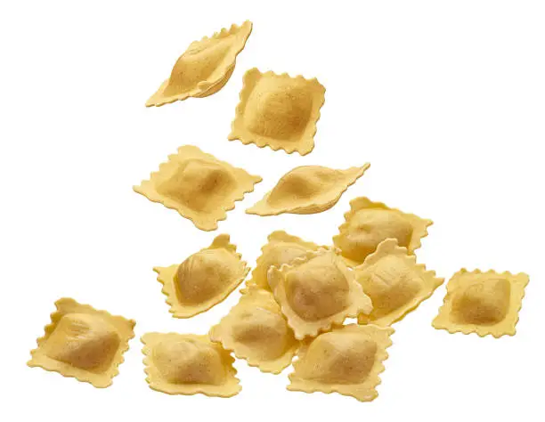 Falling Italian ravioli pasta isolated on white background with clipping path, filled dumplings, full depth of field