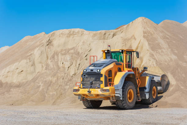 istock Wheel loaders moving sand in a quarry. 1490142990