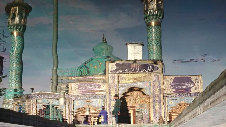 Mosque reflected over a wavy water in Tehran