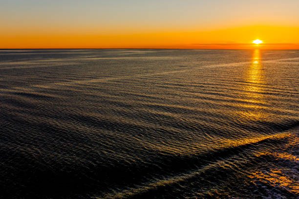 istock Sunset. Water surface. Orange sky. Baltic Sea 1490143688