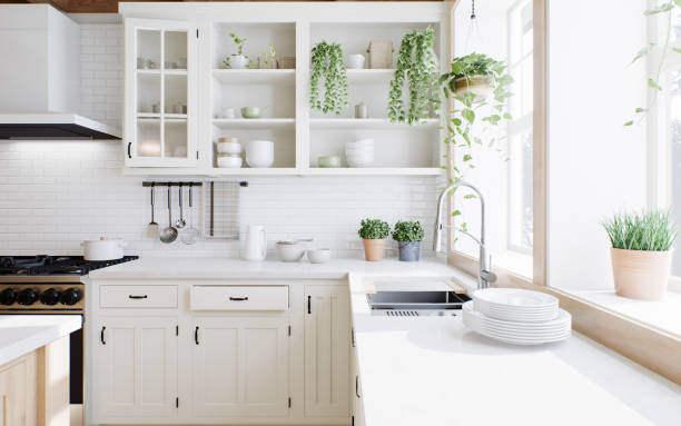istock Washing by the window. Kitchen with greens, plates and white cabinets. Cozy bright kitchen. Stylish, cozy kitchen with appliances and plants with sun rays. 3d rendering 1490146358