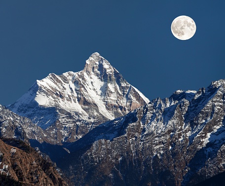 mount Nanda Devi, night view with moon, one of the best mounts in Indian Himalaya, seen from Joshimath Auli,  Uttarakhand, India