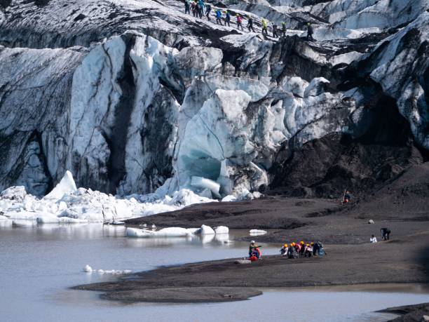 istock Breathtaking landscape featuring snow-capped mountains and a glacier with rocky outcroppings 1490171849