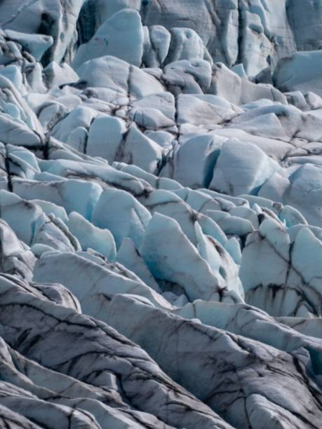 istock Breathtaking landscape featuring snow-capped mountains and a glacier with rocky outcroppings 1490171890