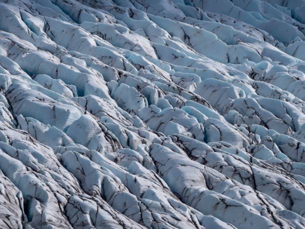istock Breathtaking landscape featuring snow-capped mountains and a glacier with rocky outcroppings 1490171900