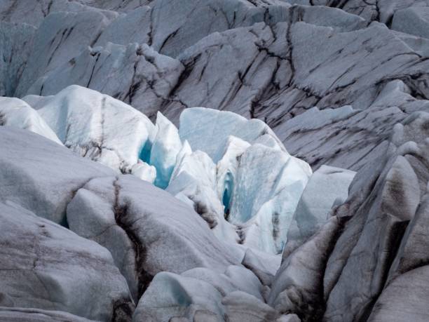 istock Breathtaking landscape featuring snow-capped mountains and a glacier with rocky outcroppings 1490171991