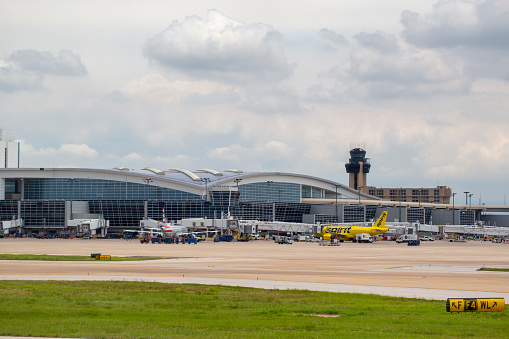 Spirit Airlines and American Airlines aircrafts parked at Terminal D at Dallas/Fort Worth International Airport in June 2022.
