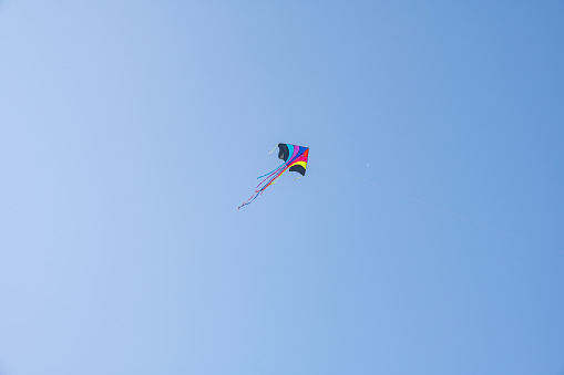 A kite under the blue sky on a sunny day