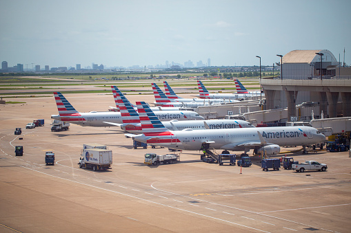 A group of American Airlines aircrafts parked at Terminal C at Dallas/Fort Worth International Airport in June 2022.