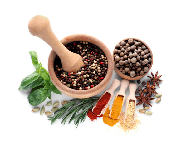 istock Mortar with pestle and different spices on white background, top view 1490188640