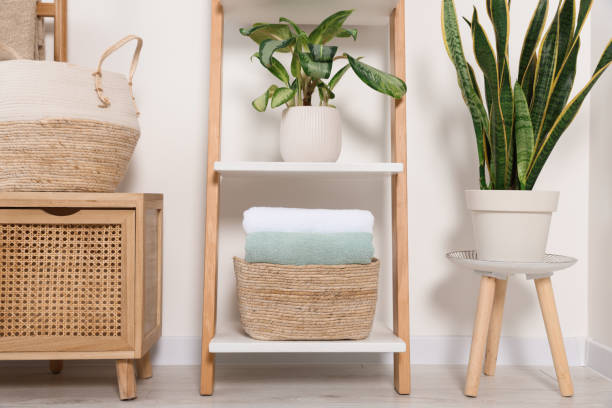 istock Soft towels on decorative ladder near white wall 1490200730
