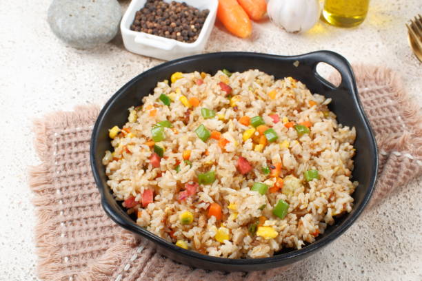 fried rice with vegetables in a plate, asian food - bean vegetarian food stir fried carrot imagens e fotografias de stock