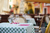 Beautifully decorated small outdoor restaurant tables in the city of Lerici, Italy