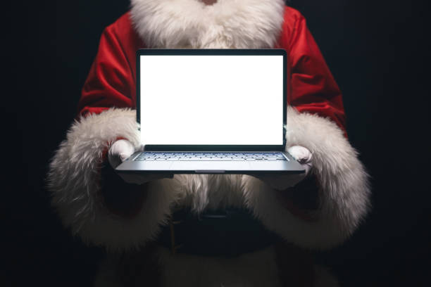 istock Santa Claus with a laptop in his hands 1490210592