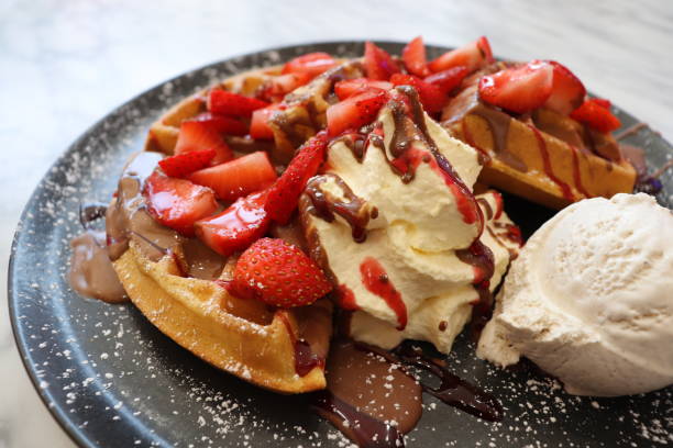 istock Waffles with chocolate, strawberry, Ice cream and whipped cream 1490213086
