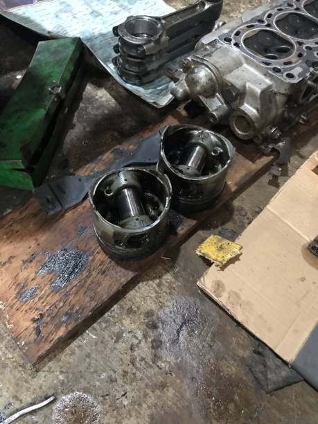 istock 2 piston heads and a 4 stroke engine combustion chamber being repaired in the workshop 1490215765