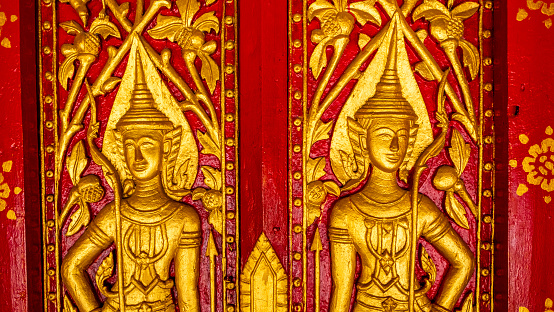 Golden fresco at the Wat Hosian Voravihane Temple in Luang Prabang Laos