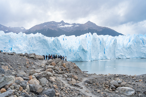 El Calafate Santa Cruz Argentina - January 13, 2023: The tourists have gotten very close and are looking at the Perito Moreno Glacier.