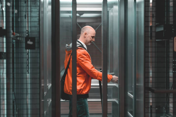 istock man in elevator, door closing, view from outside 1490223935