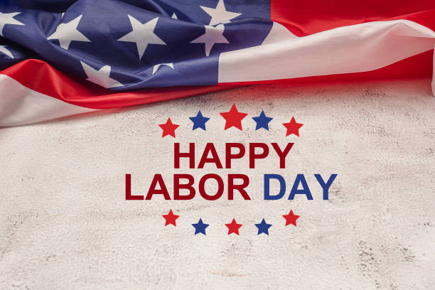 istock Happy labor day text over a cement floor background and American Flag 1490231061
