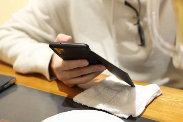 istock I touch my smartphone while waiting for my order at an izakaya 1490231952