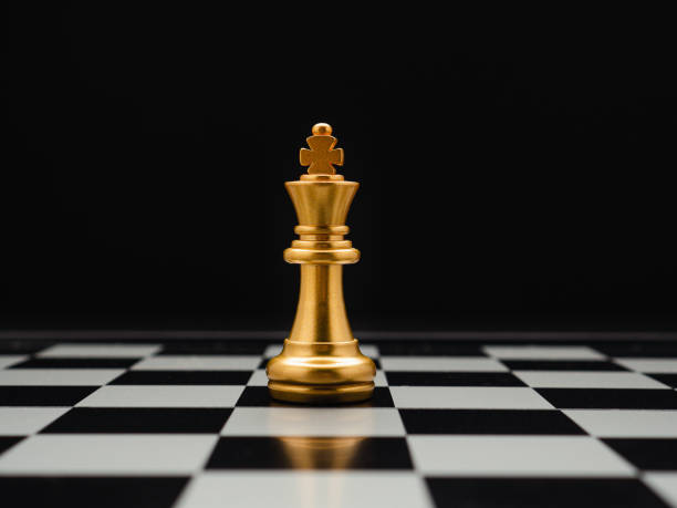 istock Chess piece on board game planning and competition on black background 1490232105
