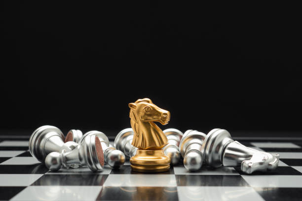 istock Chess pieces on board game planning and competition on black background 1490232141